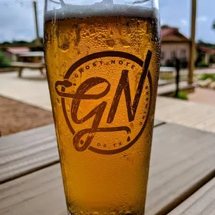 a glass of beer on a table