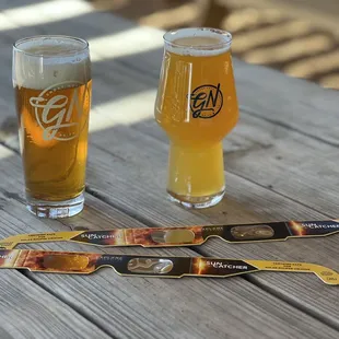 two glasses of beer on a table
