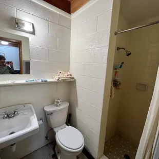 The shower, where the was no light, and had a lower floor than the bathroom.