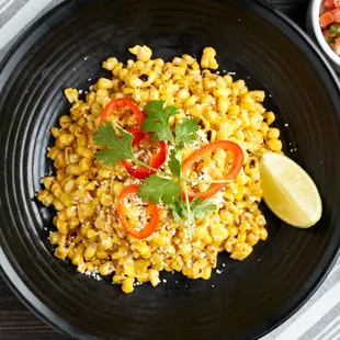 Wok-Charred Street Corn is the perfect accompaniment to any of our delicious tacos.