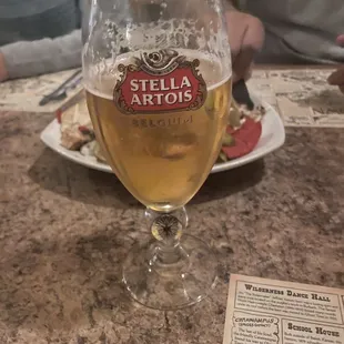 a glass of beer on a table