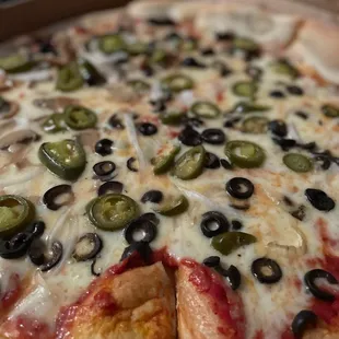 Veggie pizza, jalapeños, olives and onions only