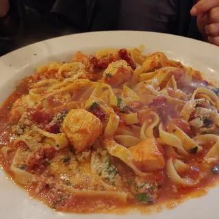 Fettuccine with Salmon and Sun Dried Tomatoes in a Lobster Based Tomato Cream Sauce