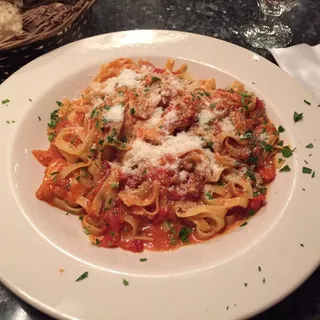 Fettuccine with Chicken, Peppers and Onions in a Tomato Cream Sauce