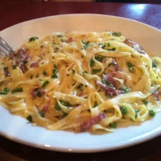 Fettuccine with Prosciutto and Peas in a Garlic Cream Sauce