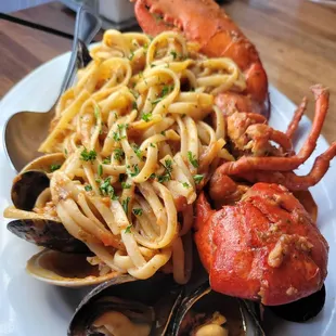 a plate of seafood and pasta