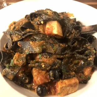 Squid ink pappardelle with Swordfish and Tuna.  Fish is a bit dry, but pasta and sauce is lovely