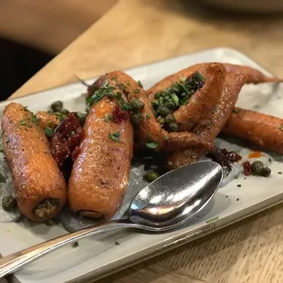 a plate of baby carrots