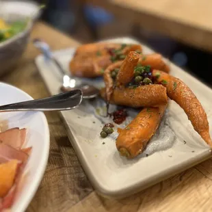 a plate of carrots and a salad