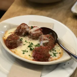 a plate of meatballs and sauce