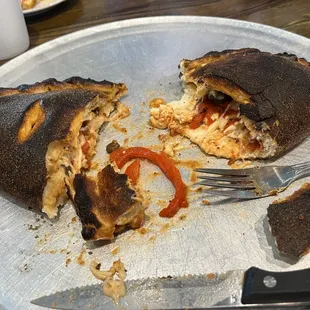 VERY burnt 3 ingredient calzone- sausage, black olives &amp; red pepper that was supposed to be red onion.
