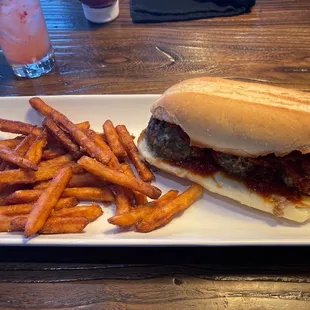 Meatball sandwich and fries