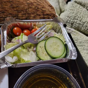 $8.50 tiny salad.   My fork is almost as large as the salad. You can also see my oil with the almost non-existant dipping seasoning.