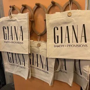 three bags hanging on a wall