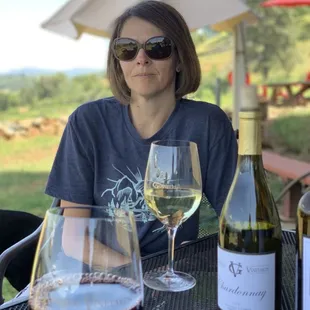 On the patio enjoying some Chardonnay and Primitivo.