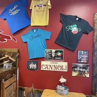 t - shirts hanging on the wall