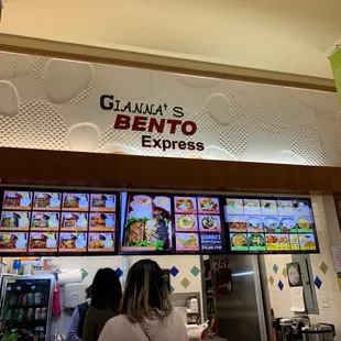 a woman standing in front of the counter