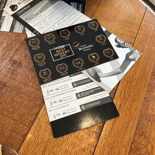 a table with wine glasses and menus