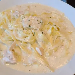 a bowl of chicken and noodles