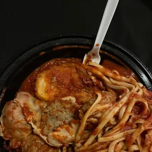 Garlic bread under all the spaghetti