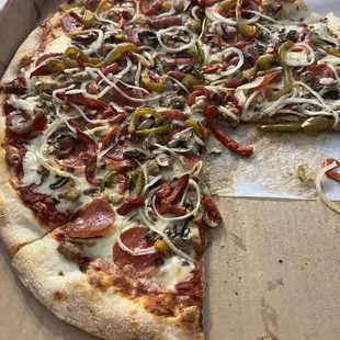 a half eaten pizza in a box