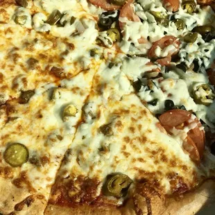 Half veggie, half sausage &amp; pepperoni pizza. New York style.