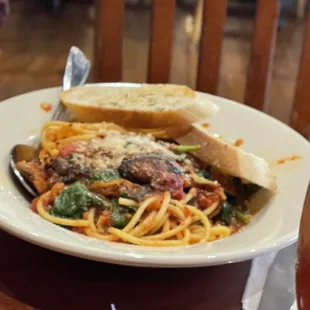 a plate of spaghetti and meat