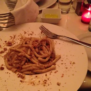 Bigoli al Ragu d'Agnello e Noci Tostate