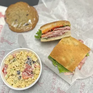 a sandwich and pasta salad