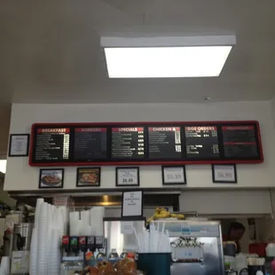 menus on the wall above the counter