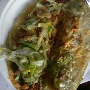 a close up of a taco on a plate