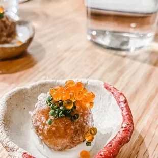 a plate of food on a wooden table