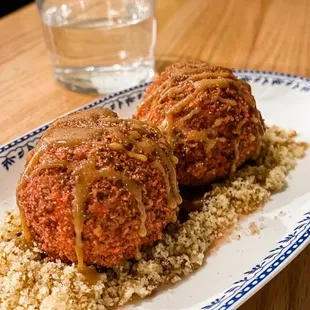 a plate of food on a wooden table