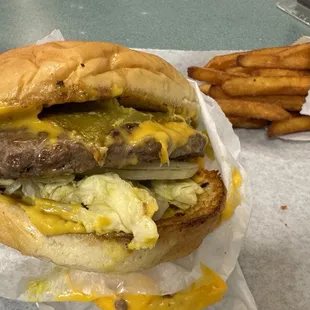 Flat top grilled, giant cheese burger with green chilies! Oh...and really good fries