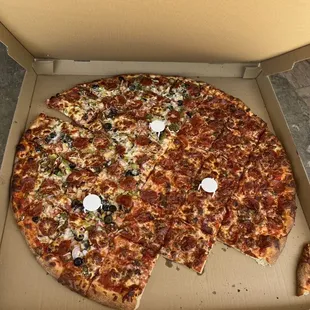 Their Giant pizza half works and half meat lovers