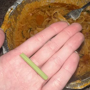 piece of green rubber in the pasta