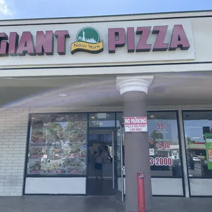 the entrance to giant pizza