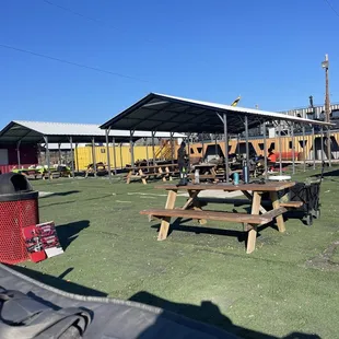 Waiting area is very nice with shade over the tables.