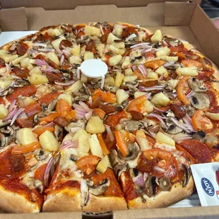 Pepperoni, sausage, pineapple, mushrooms, red onion and tomatoes (one side)