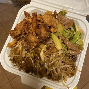 a take out container of food