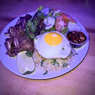 Beef short ribs with fried rice, egg on top