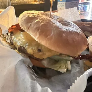 Bacon cheeseburger with lettuce, tomato, pickles, American cheese and Mayo