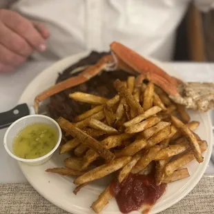 Ribeye, crab legs, and fries