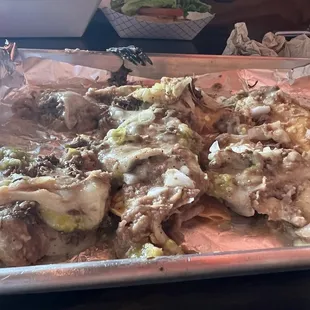 Not 100% sure but menu says barbacoa nachos