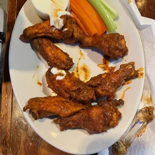 Hot lemon pepper wings (half eaten)