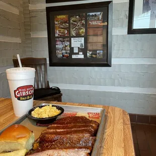ows a tray of ribs and sides