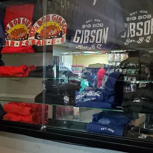 ows a display of shirts in a window