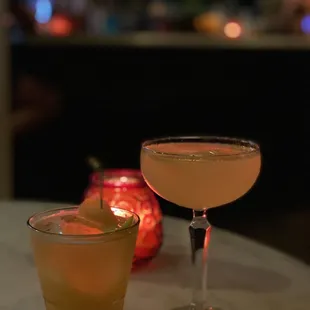 two cocktails on a table