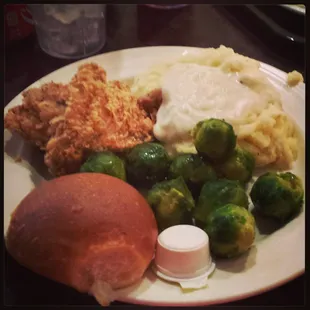 Fried chicken, brussel sprouts, mashed potatoes with white gravy and dinner roll!