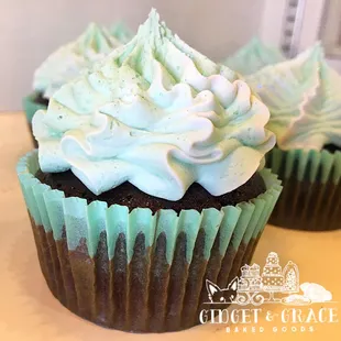 two cupcakes with frosting